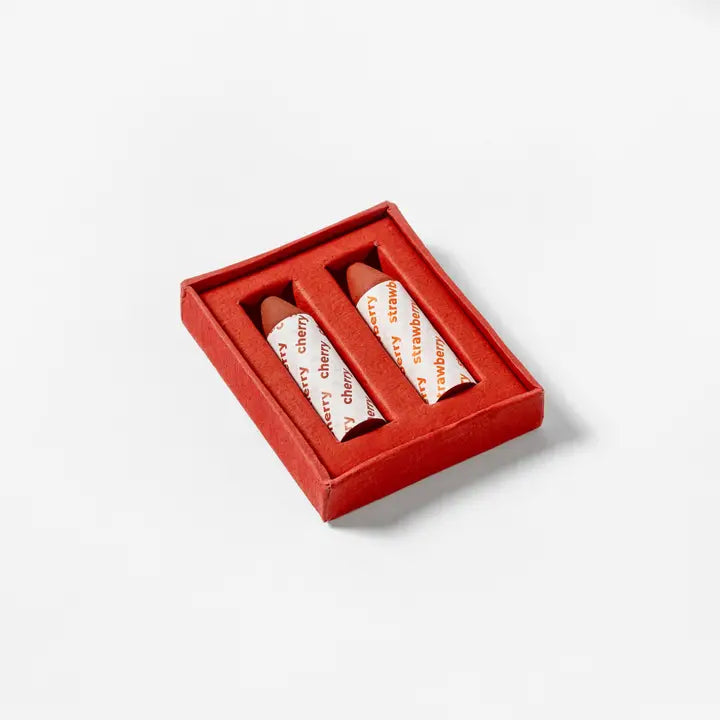 Axiology Strawberry + Cherry Balmie Duo in a recyclable red box, featuring two zero-waste, plastic-free multi-use lip and cheek color sticks