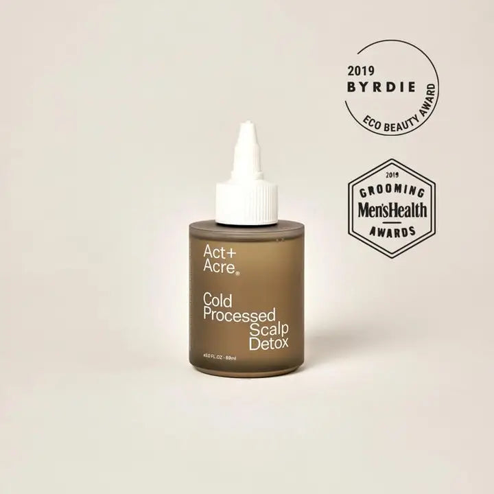 Act + Acre Cold Processed Scalp Detox bottle with dropper, featuring clean beauty certification badges and award recognition.
